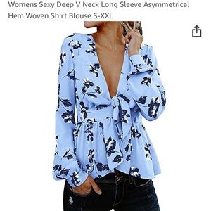 Deep V long sleeve asymmetrical shirt.